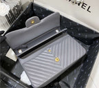 Grey Chanel woman handbag