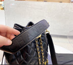Black Chanel woman handbag